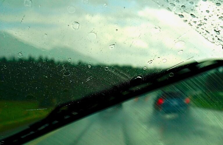 wiper on the windshield in the rain