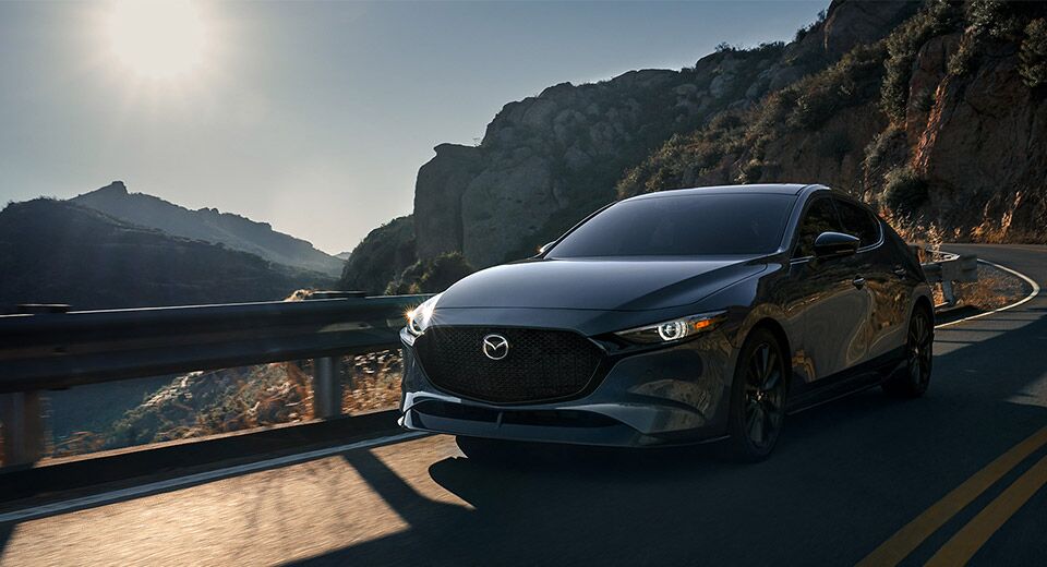 2023 Mazda3 Hatchback driving down the road