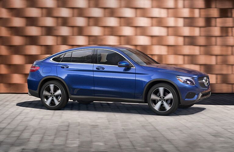 2019 MB GLC Coupe exterior front fascia and passenger side in front of brick wall
