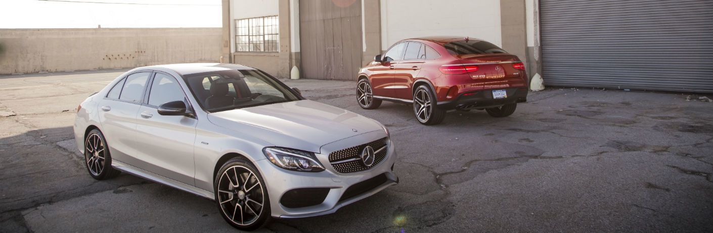 Two, 2019 Mercedes-Benz models near a garage in the city