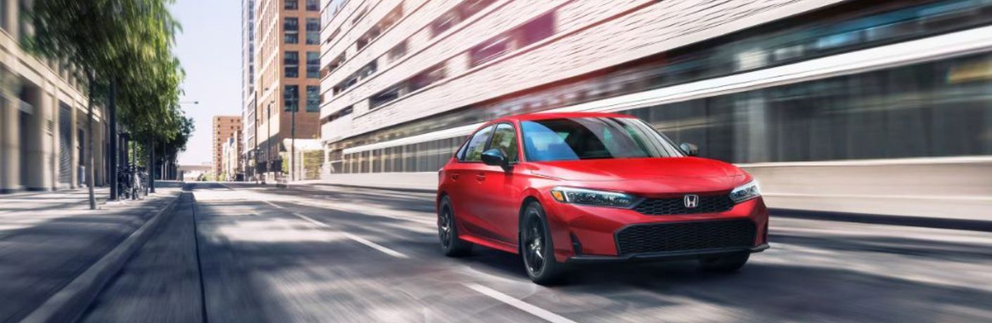 2026 Honda Civic Sedan Red on the road