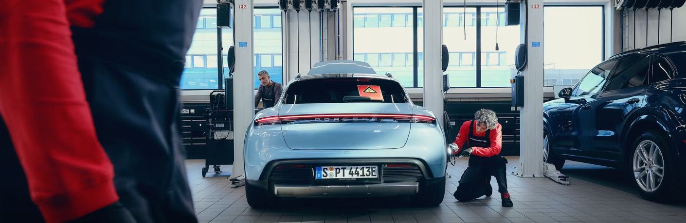 Technicians at work in a Porsche service center
