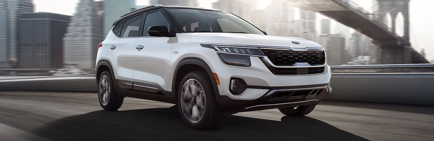 2021 Kia Seltos driving on a bridge