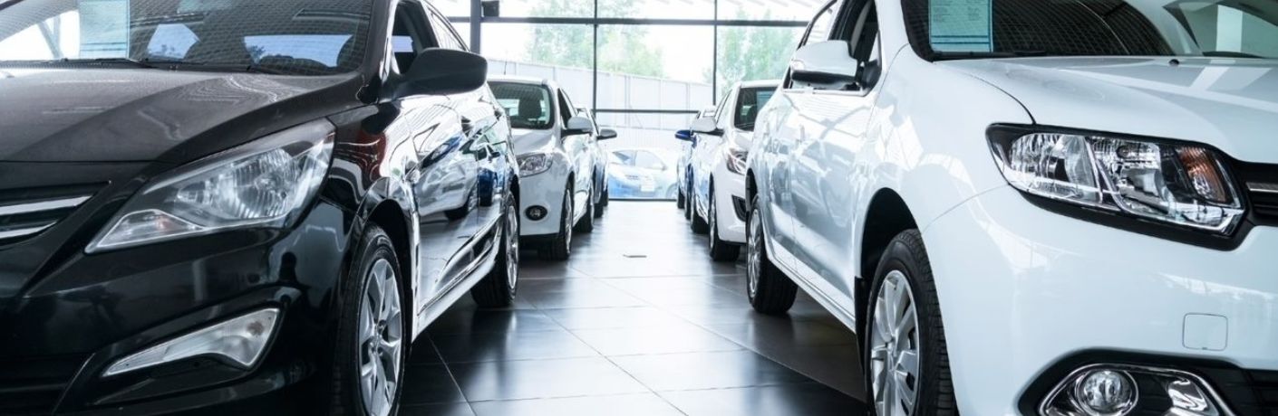 Cars kept in a showroom is shown.