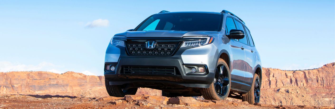 2021 Honda Passport off-roading near a mountain ridge