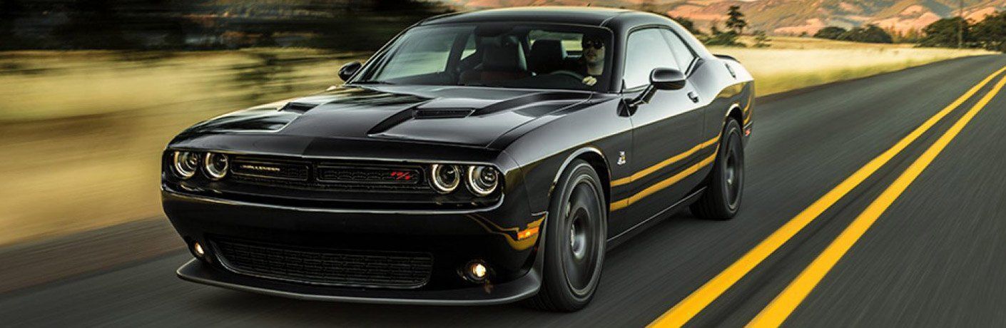 Dodge Challenger driving down road