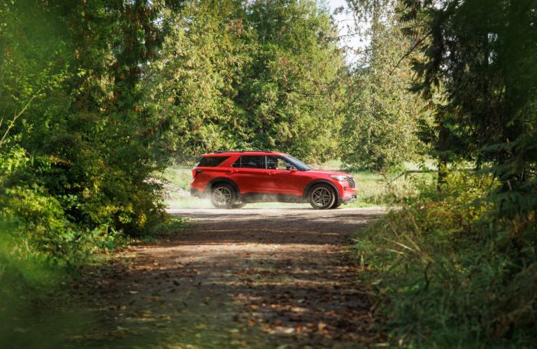 2025 Ford Explorer ST side view in a forest