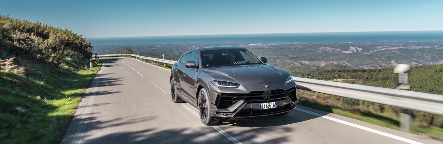 A 2024 Lamborghini Urus S speeding on a road