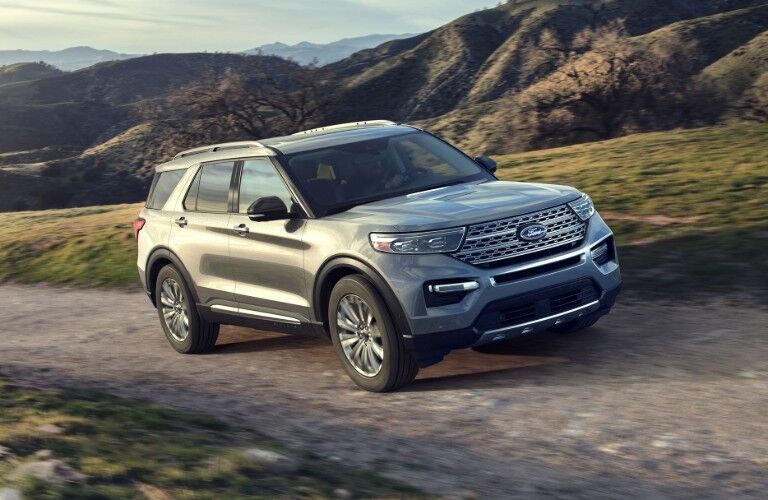 Silver 2020 Ford Explorer driving on mountainous road