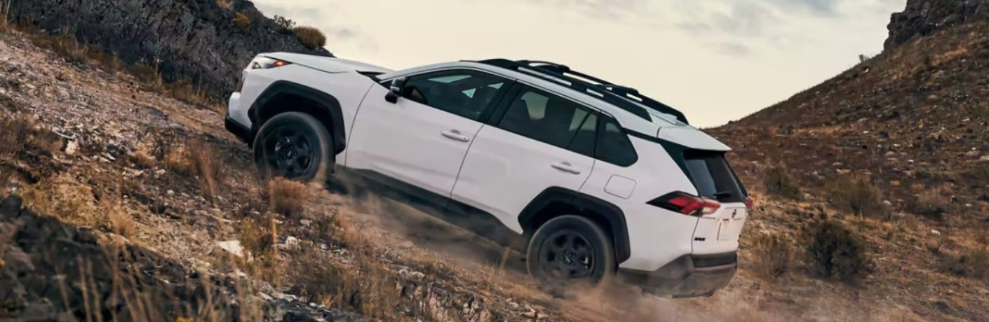 2023 Toyota RAV4 climbing a rocky terrain