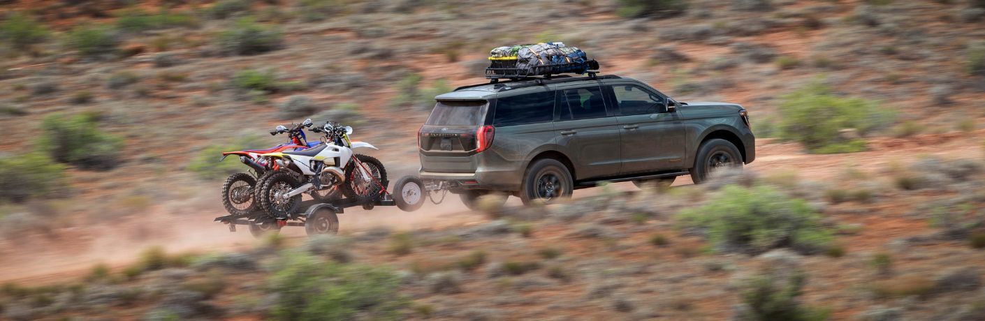 2025 Ford Expedition Tremor driving off-road towing bikes
