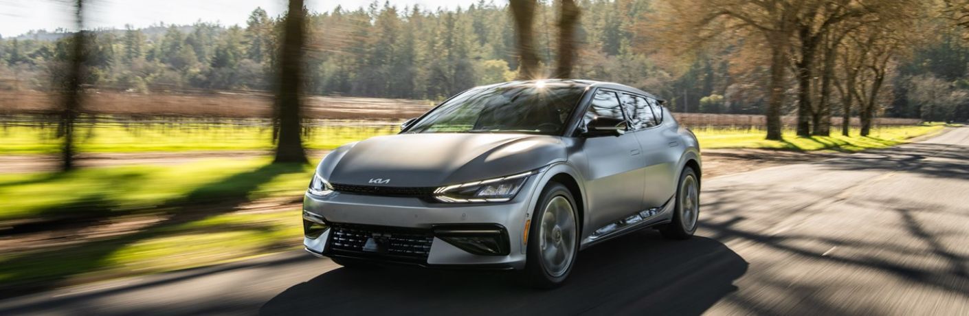 A 2022 Kia EV6 on a road abutting a farmland