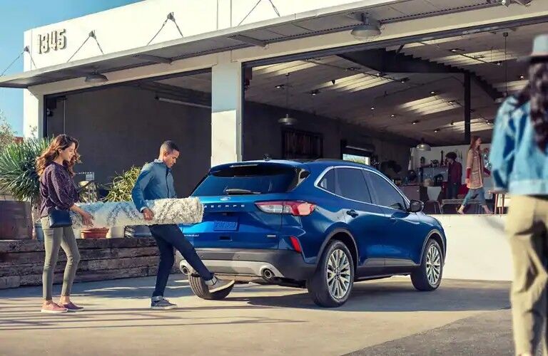 Man operating rear liftgate of 2020 Ford Escape SEL