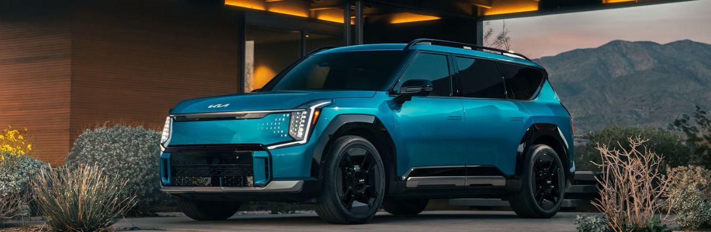 The 2026 Kia EV9 parked outisde a house