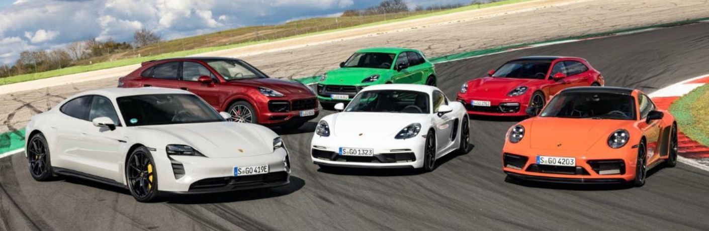Used Porsche models parked on a racing track