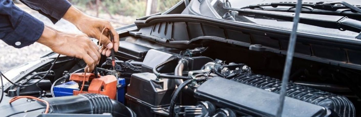 Mechanic repairing electrical system of the vehicle
