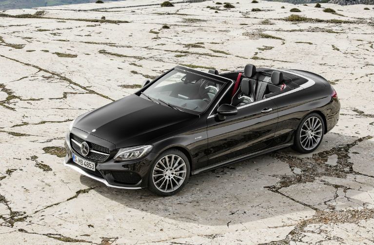 black Mercedes-Benz Cabriolet parked in open space