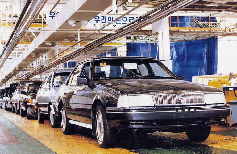 image of Kia Concord sedans parked in a factory