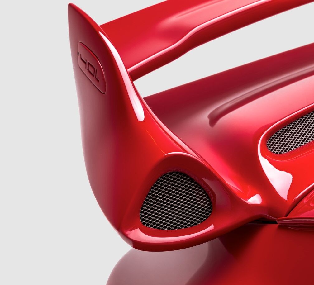 red Porsche Coupe model wing close up