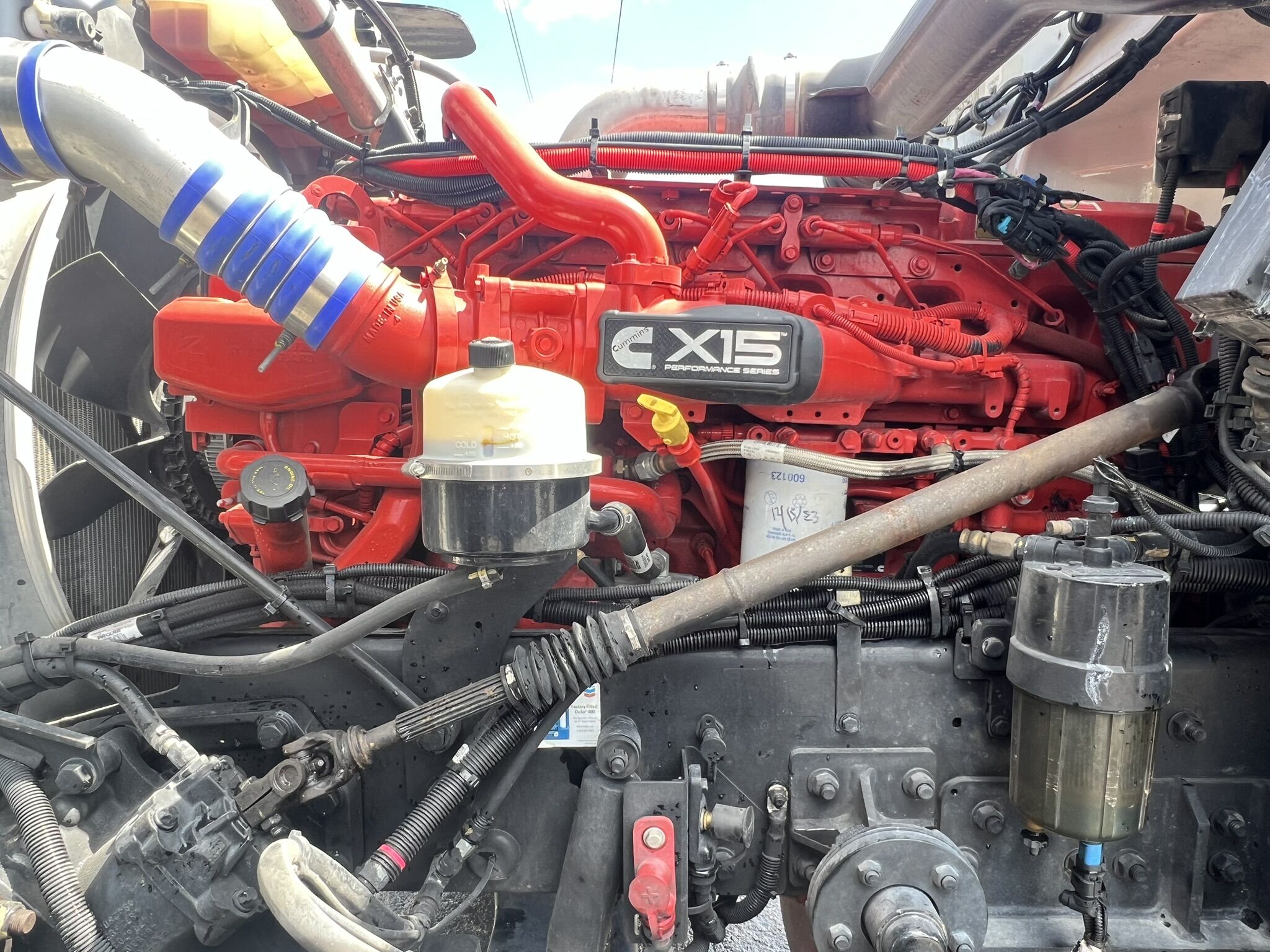 A man running diagnostics on a commercial truck