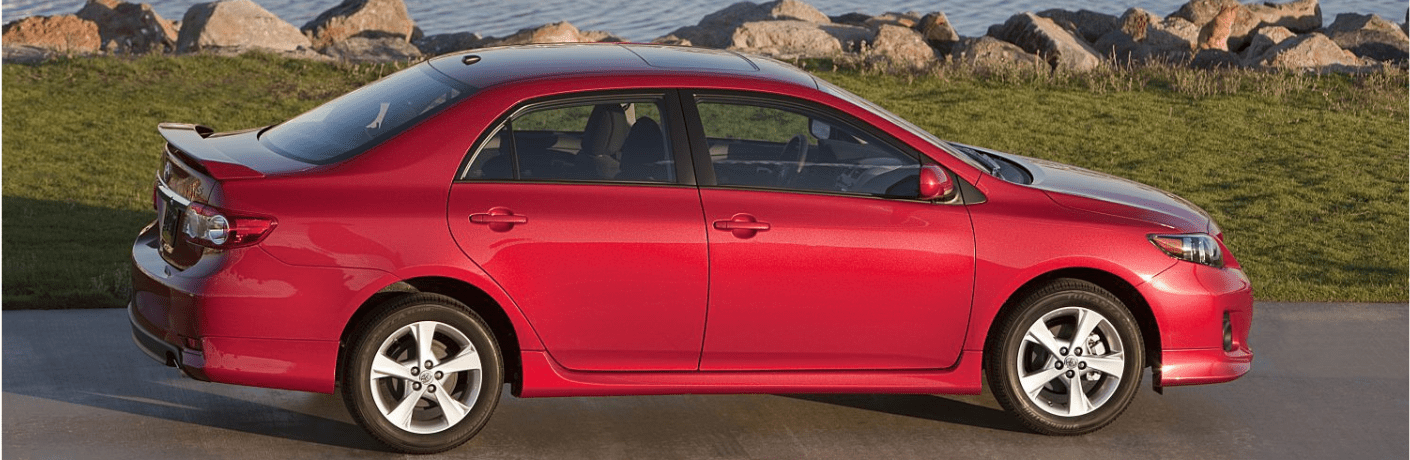 2011 Toyota Corolla side view parked near a river