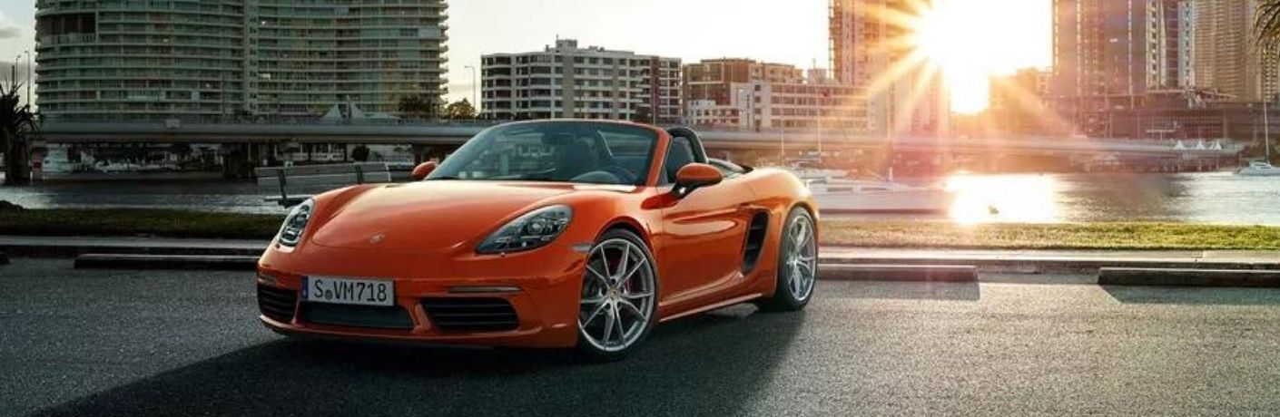 2022 Porsche 718 Boxster Orange parked on the road