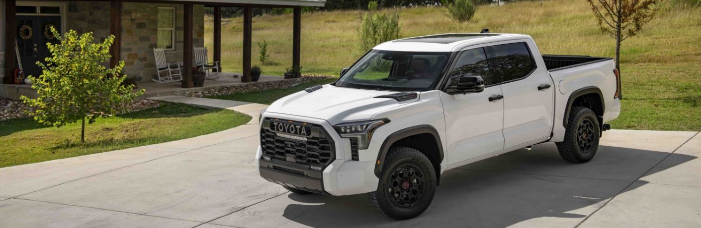 A 2022 Tundra parked in front of a house