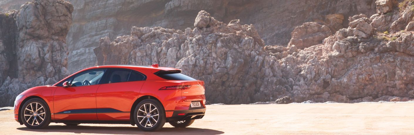 Side View of the 2019 Jaguar I-Pace against the mountains