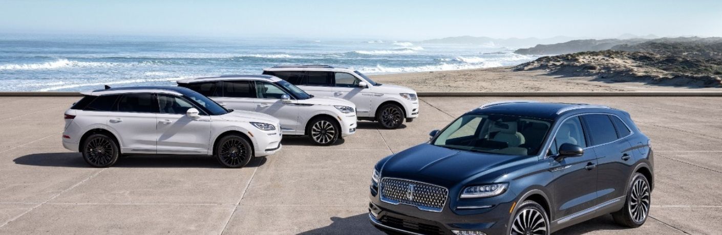 Lincoln Luxury Vehicles Parked Outside in a Beautiful Setting