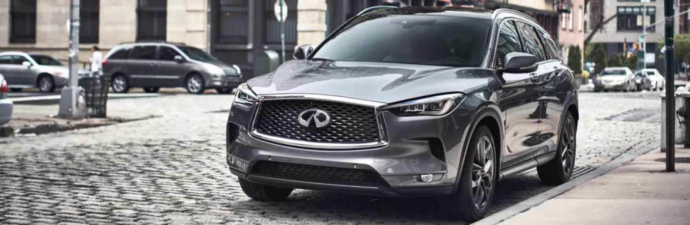 A 2024 INIFINITI QX50 on a city road