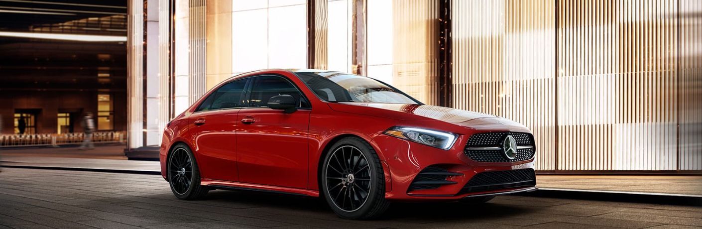 An image of the side view of a Red 2022 Mercedes-Benz A-Class