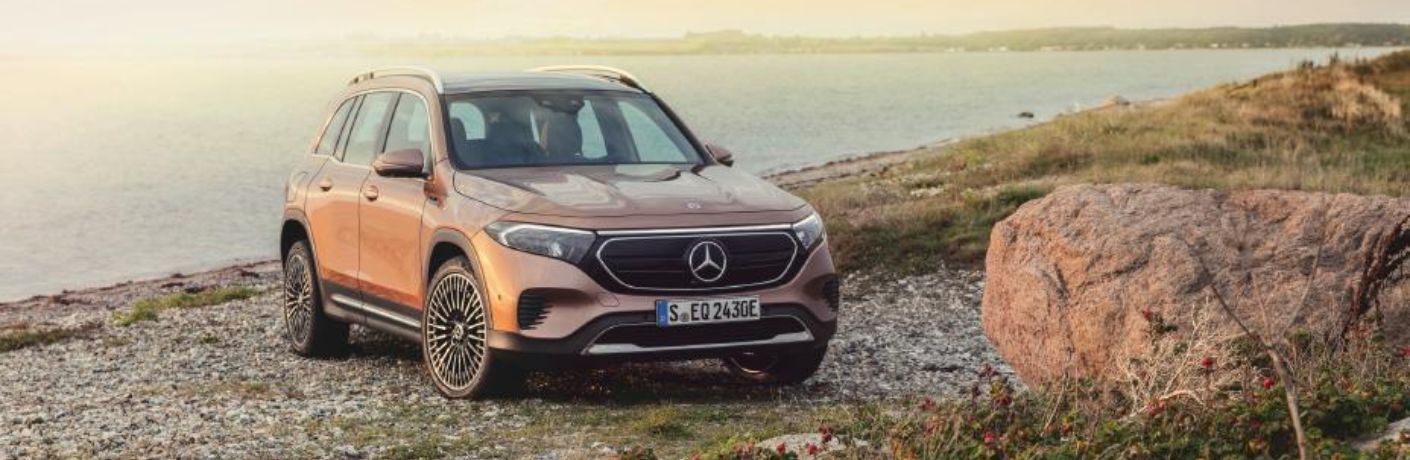 2024 Mercedes-Benz EQB 350 4MATIC® SUV parked off-road near a lake