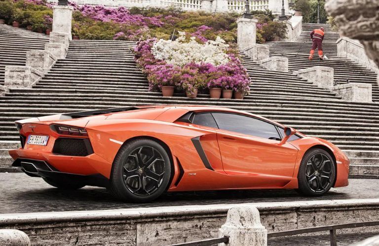 Lamborghini Aventador parked beside stairs