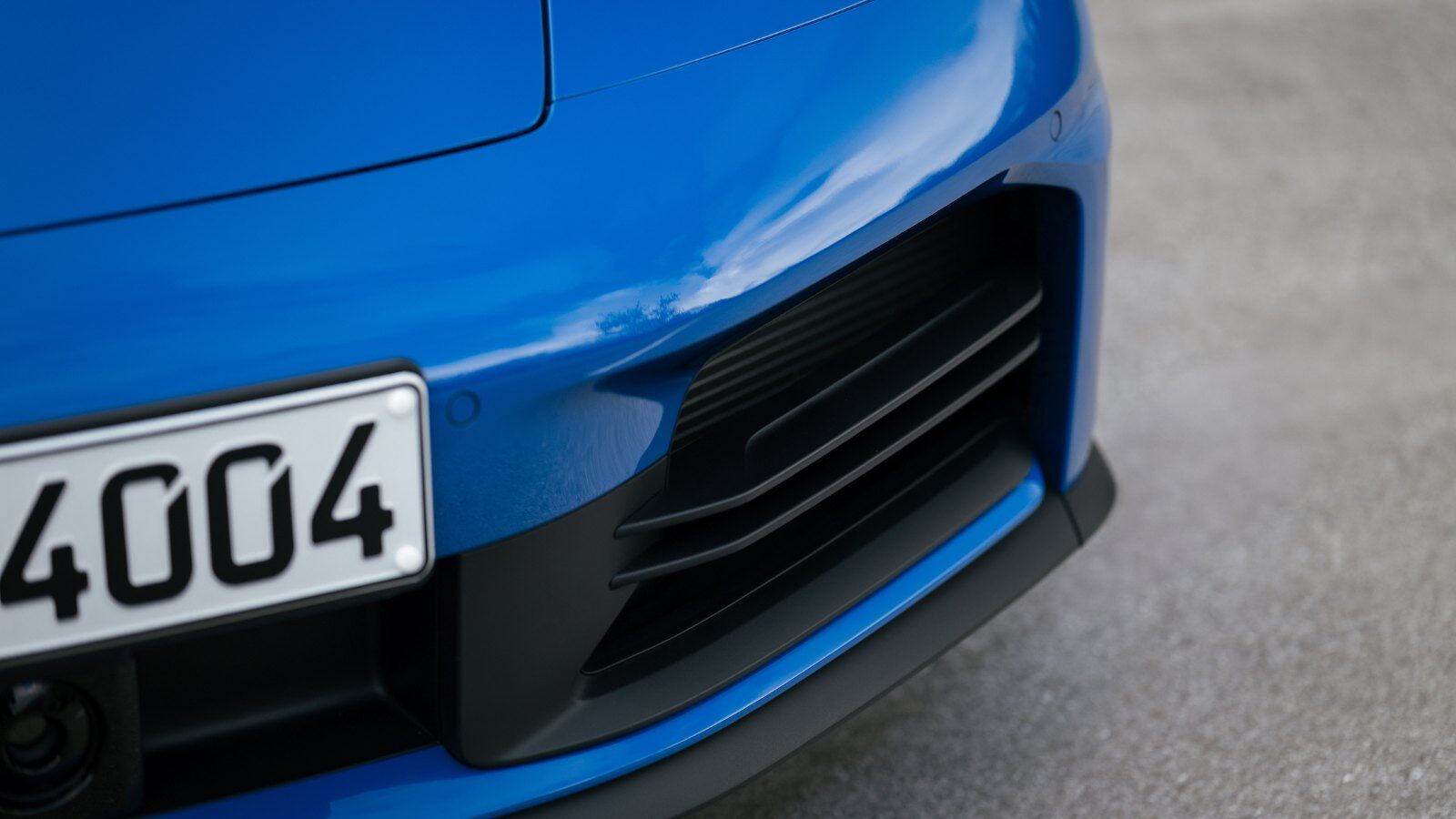 Porsche 911 front end where the Wet Mode sensors pick up water spray – Champion Porsche Pompano Beach, FL