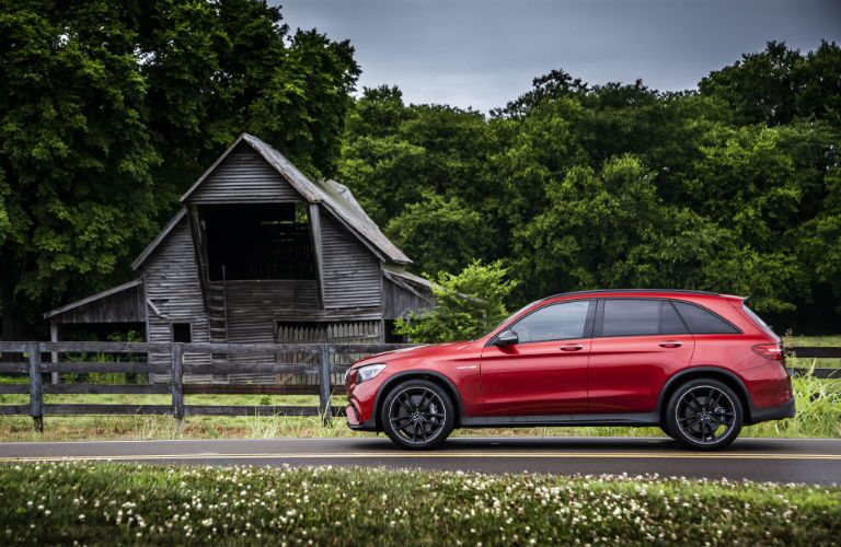 2018 MB GLC SUV exterior driver side profile in front of shed and wood fence