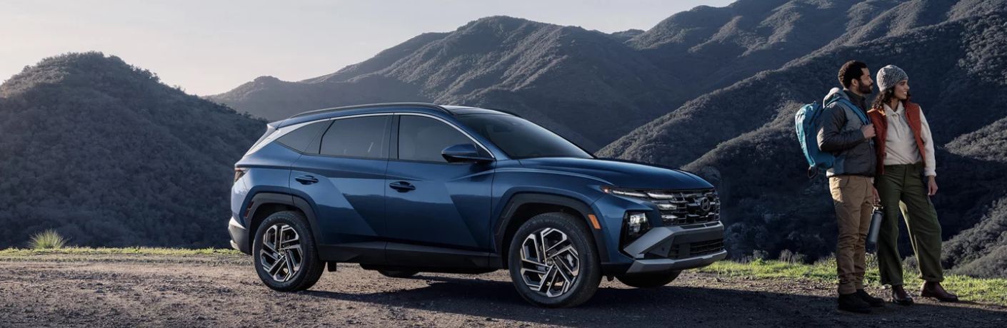 2026 Hyundai Tucson side view by mountains