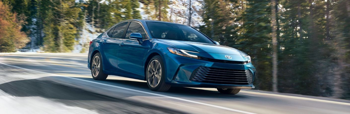 A 2025 Toyota Camry speeding on a road