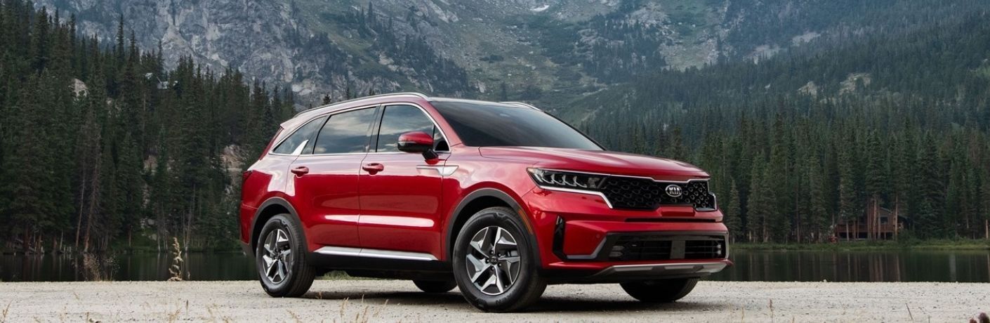 Red 2021 Kia Sorento Hybrid Front Exterior at a Mountain Lake