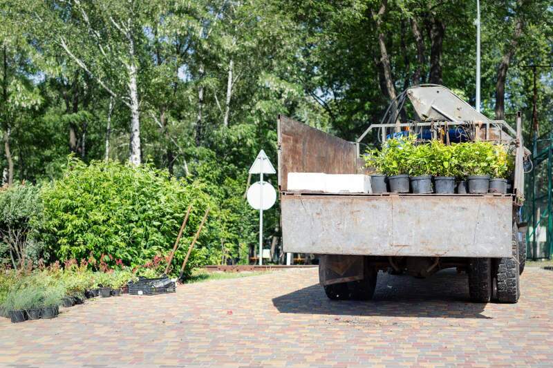 A landscaping truck on the street.