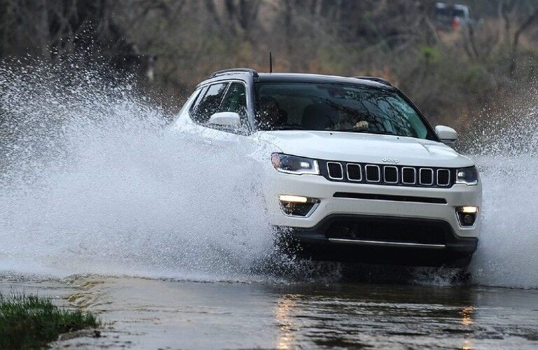 2021 Jeep Compass going through a puddle of water