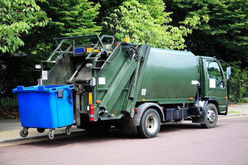 A pre-owned garbage truck