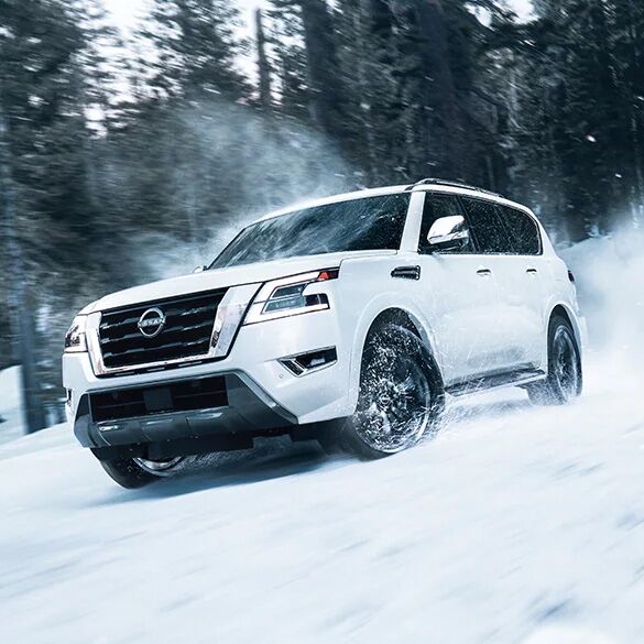 2024 Nissan Armada driving through snow.