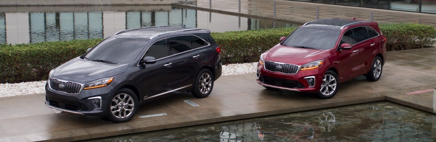 Exterior view of one gray and one red 2020 Kia Sorento models