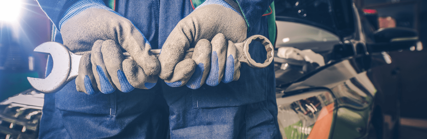 Technician posing with a tool