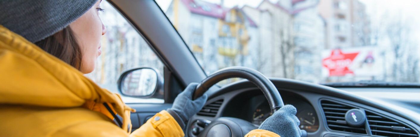 Driver inside a cold vehicle in the winter