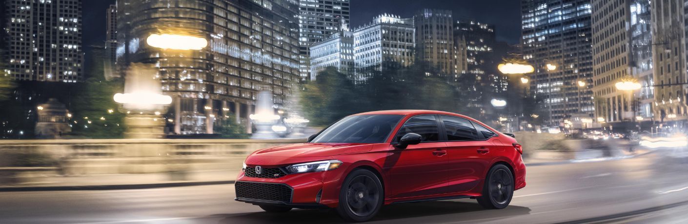 2025 Honda Civic Si Red driving on the road