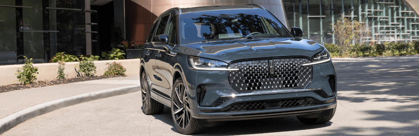 Front view of the 2025 Lincoln Aviator in front of a building