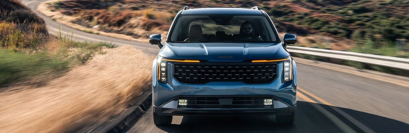 2026 Kia Carnival front view on a road