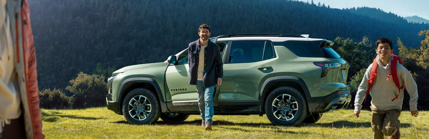 Family walking away after parking their 2025 Chevrolet Equinox