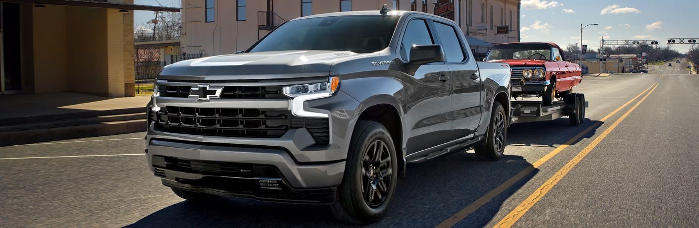 front quarter view of the Chevrolet Silverado 1500 towing a car